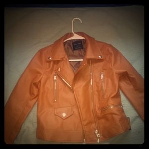 A tan leather jacket. Measurements I cannot find.